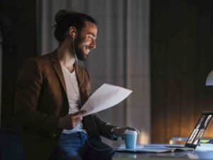 Smiley man wearing earphones on video call