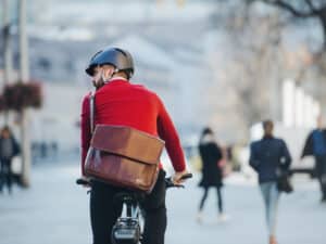 A rear view of a commuter travelling on a bike