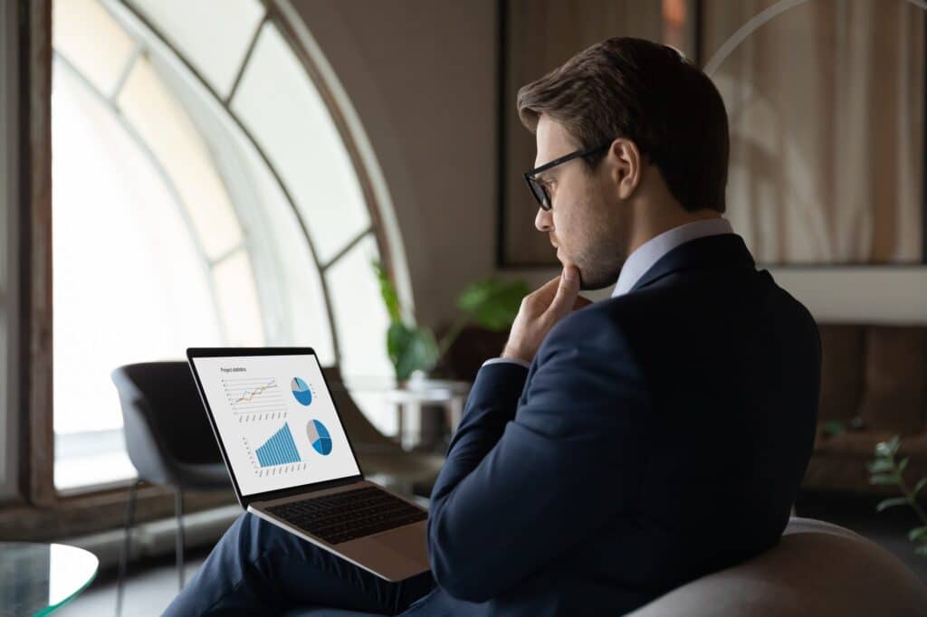 Side view of man on laptop