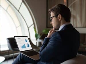 Professional man looking at a laptop