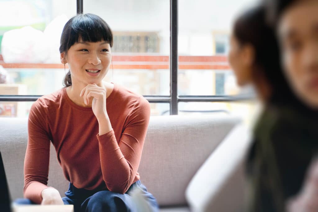 Young asian woman working in a modern co-working office