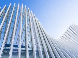 Architectural exterior white building train station structure in Italy.