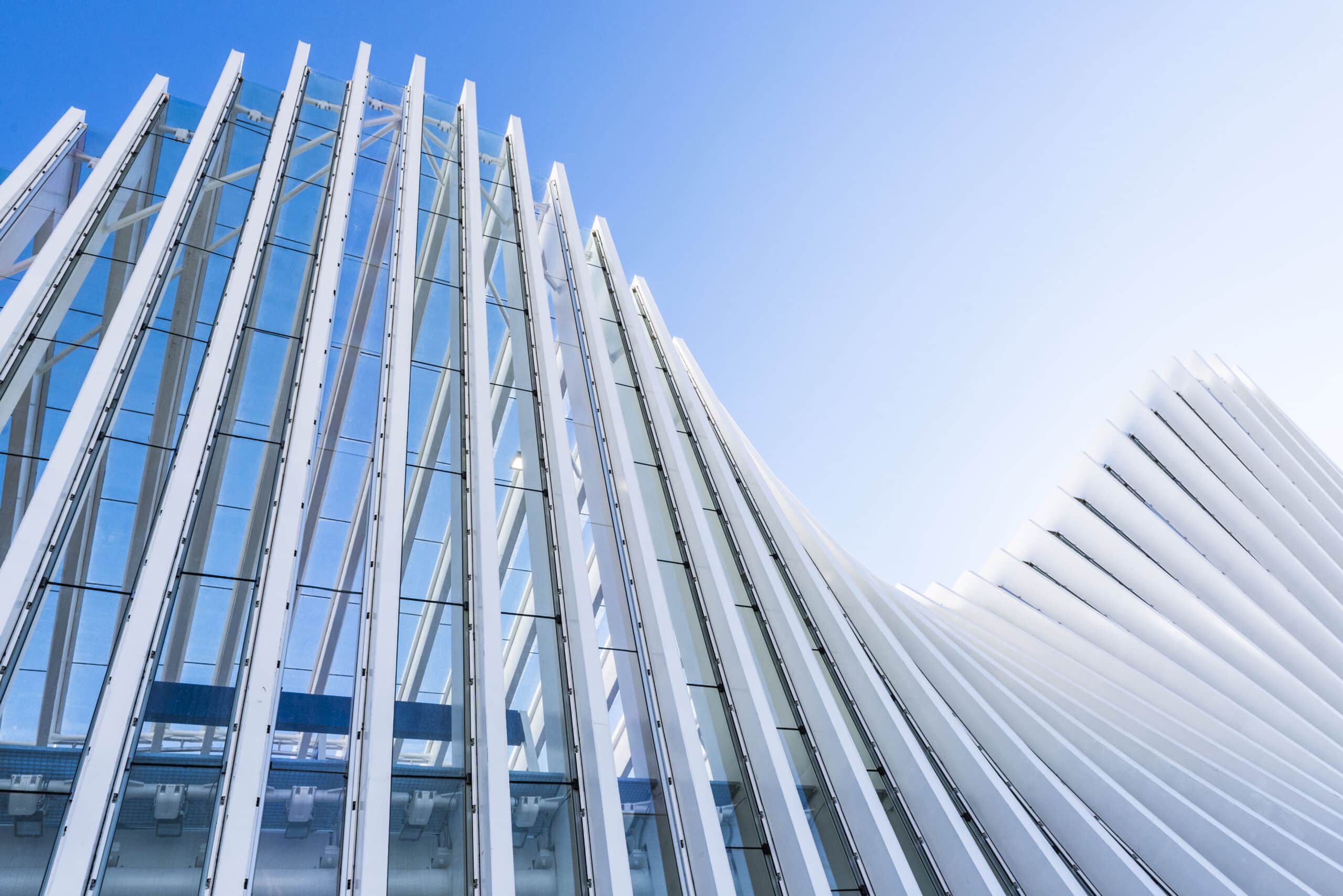 Architectural exterior white building train station structure in Italy.