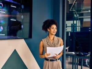 Woman presenting ideas via graphs