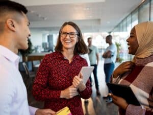 Detail_Joyful standing group interacting_iStock-1365562800