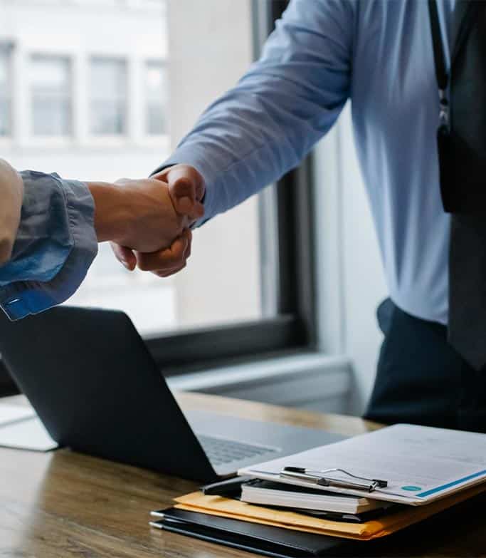 A man and woman - close up of them shaking hands